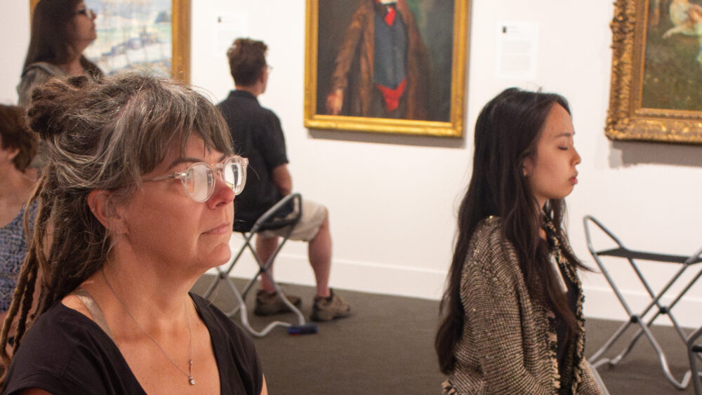 seated people looking at works of art in our galleries