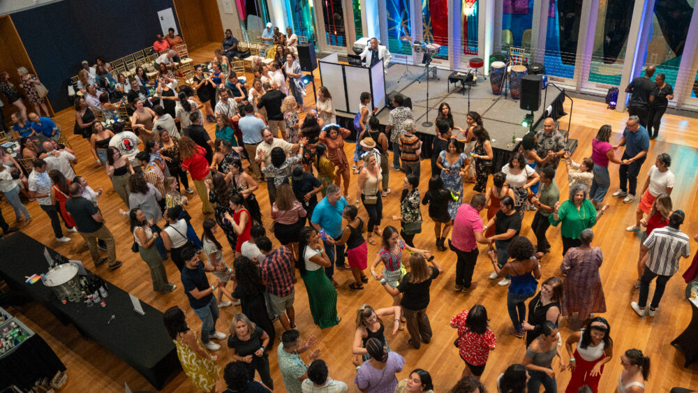 Crowd of people dancing at Mint Museum Uptown